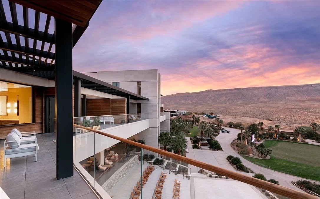 Clubhouse terrace at The Summit Club in Summerlin at sunset, overlooking the grounds and the mountains.